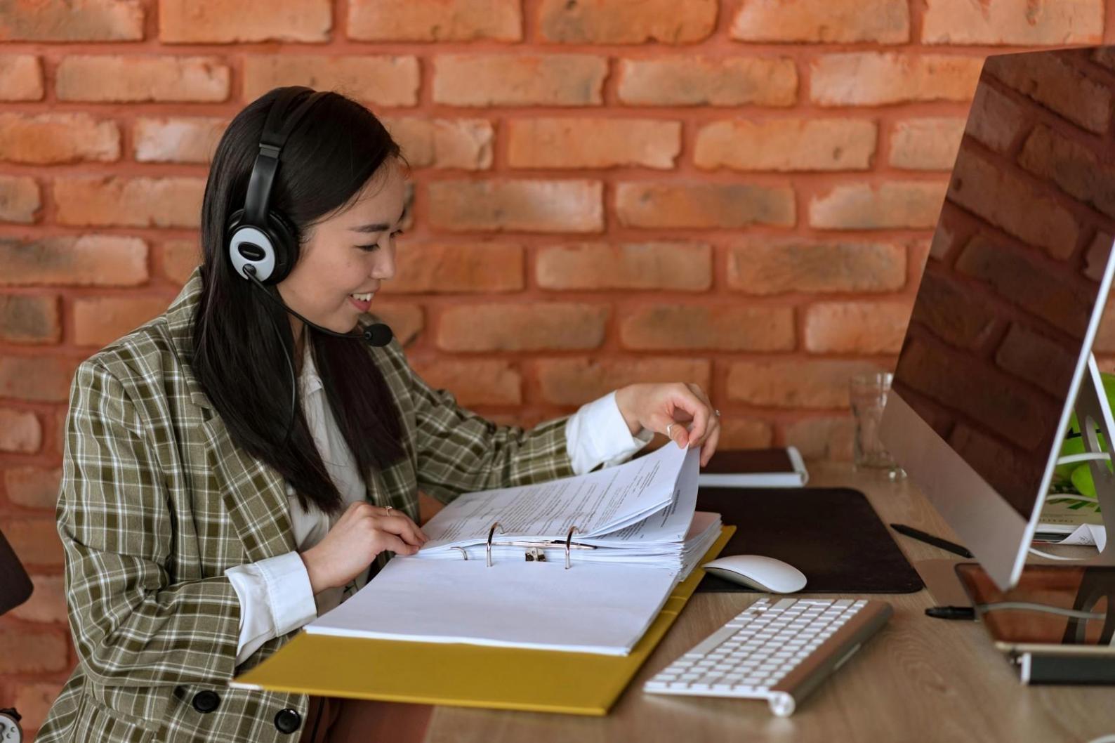 Student workspace with dual monitors showing 3D modeling software in action